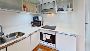 Fully equipped kitchenette with built in appliances in serviced apartment