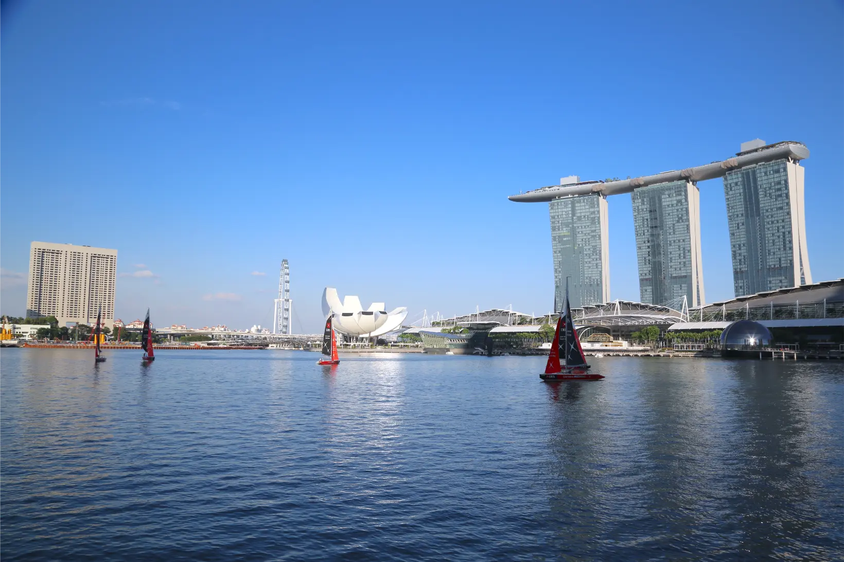 City skyline with skyscrapers and water.