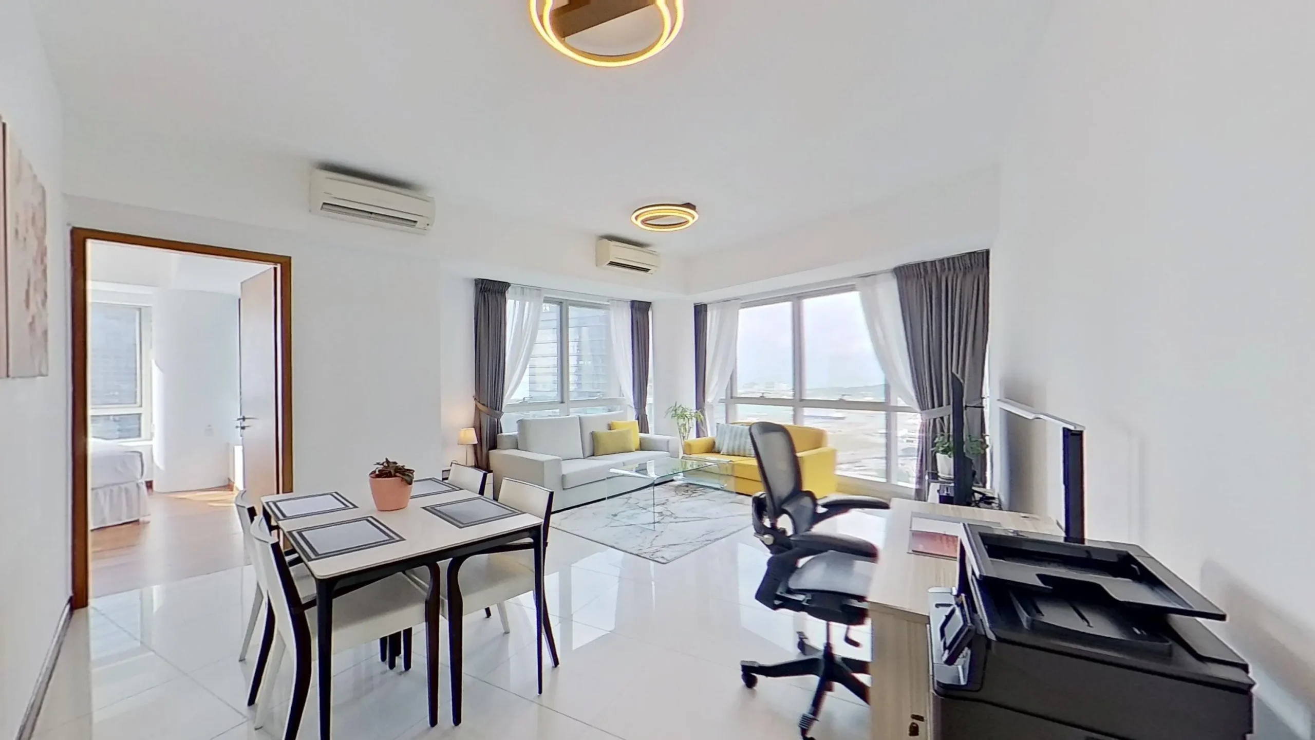 Interior design with chair, table, couch, and light fixture.
