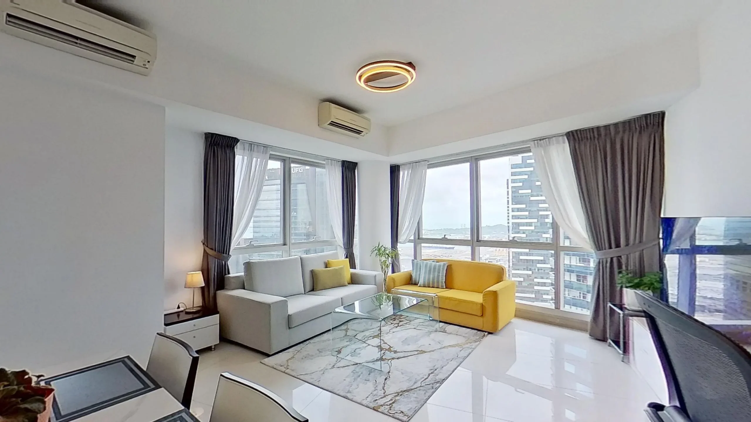 Modern living room inside a Raffles Place serviced apartment