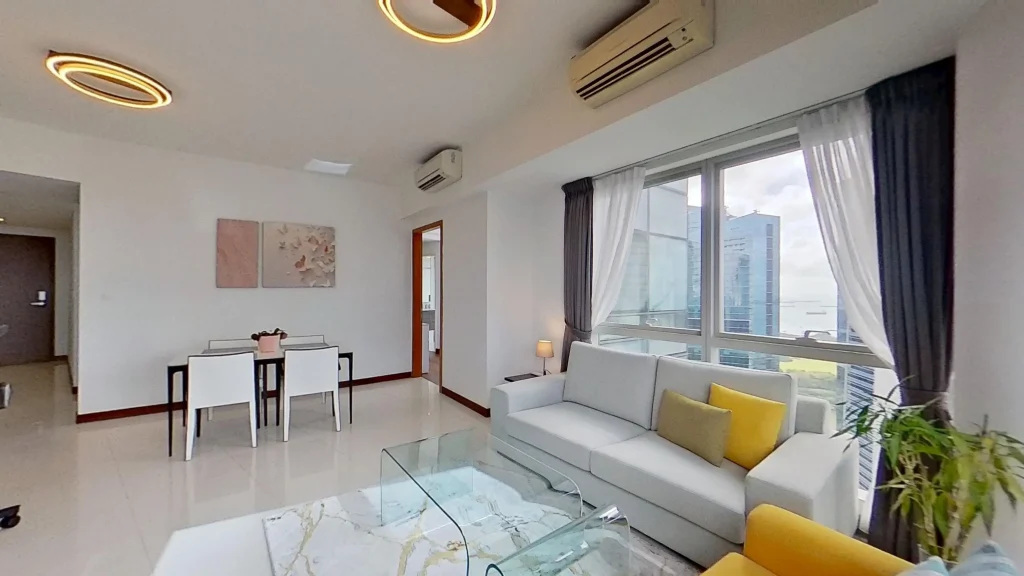 Modern living room with couch, chair, houseplant.