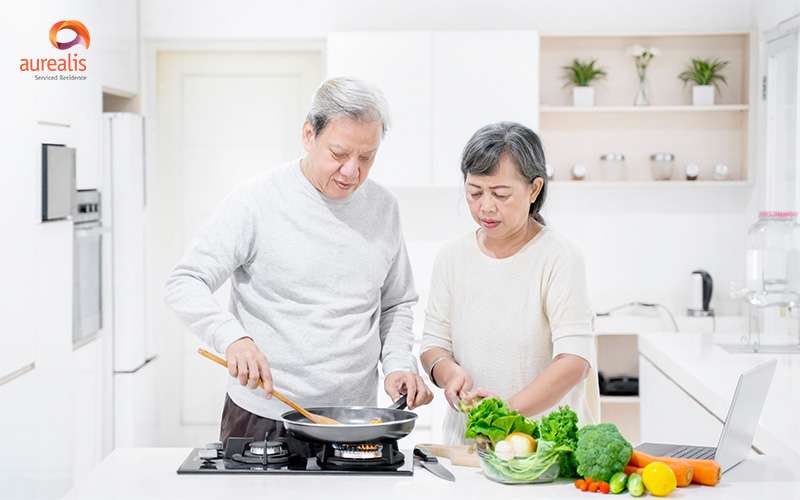 Retired couple preparing meals