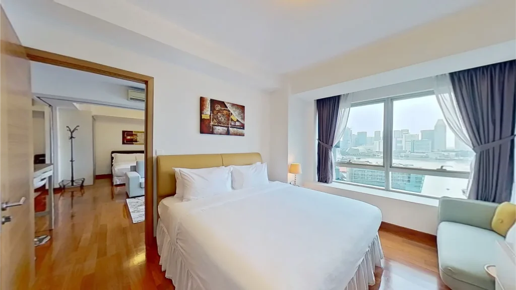 Two bedroom bayview suite master room with city view at Marina Bay