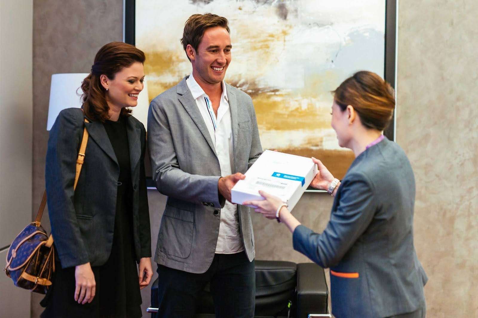 Guest service staff assisting visitors at the Aurealis luxury serviced apartment concierge