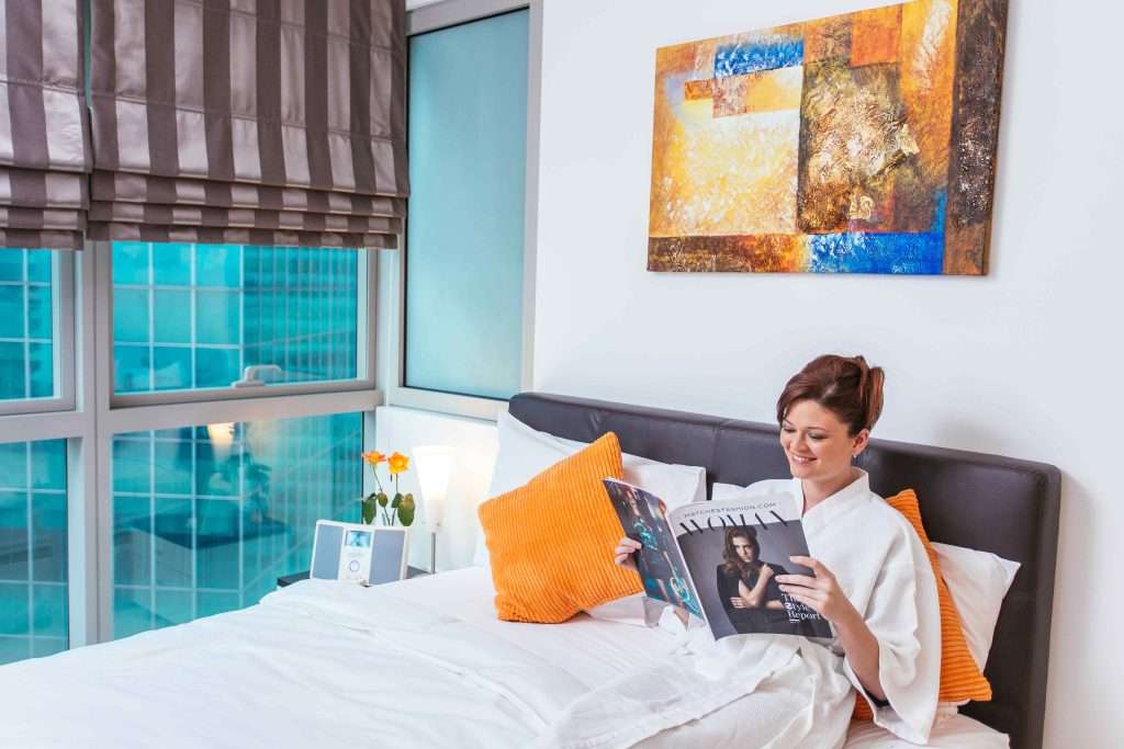 Lady resting on bed