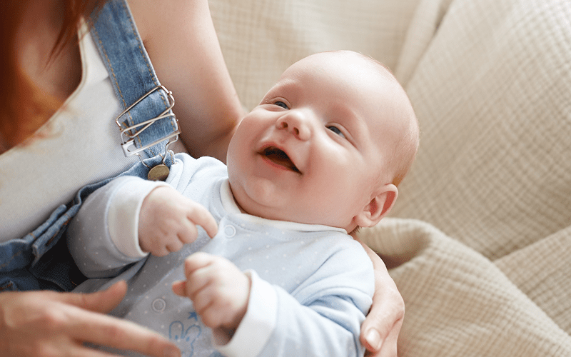 A mother and an infant enjoying a moment together.