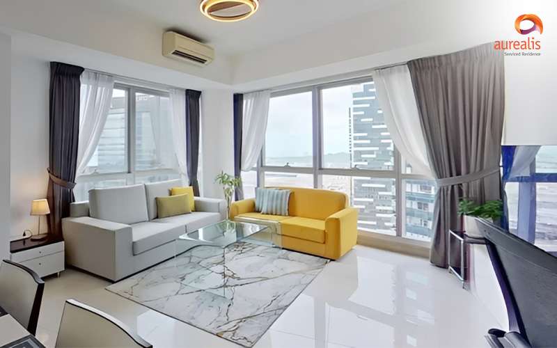 Modern Singapore serviced apartment with panoramic city skyline views.