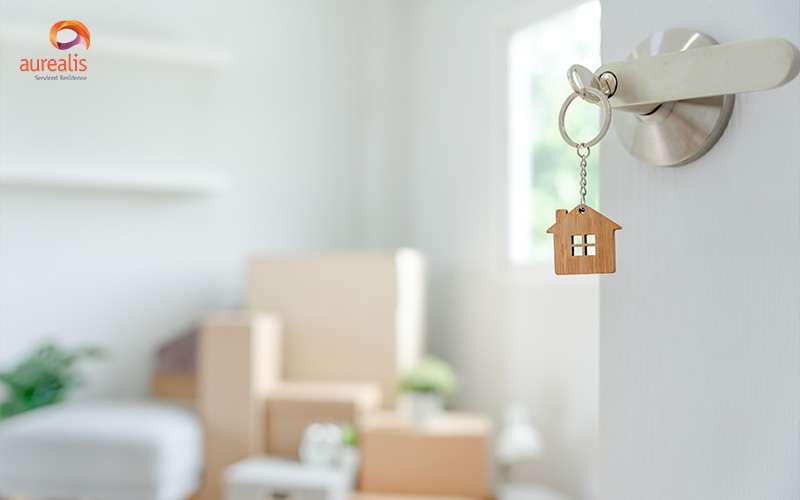 Moving boxes at home with a key in door