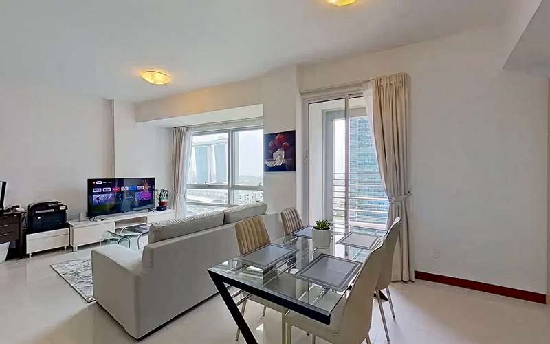 Modern serviced apartment living room with Marina Bay Sands view.