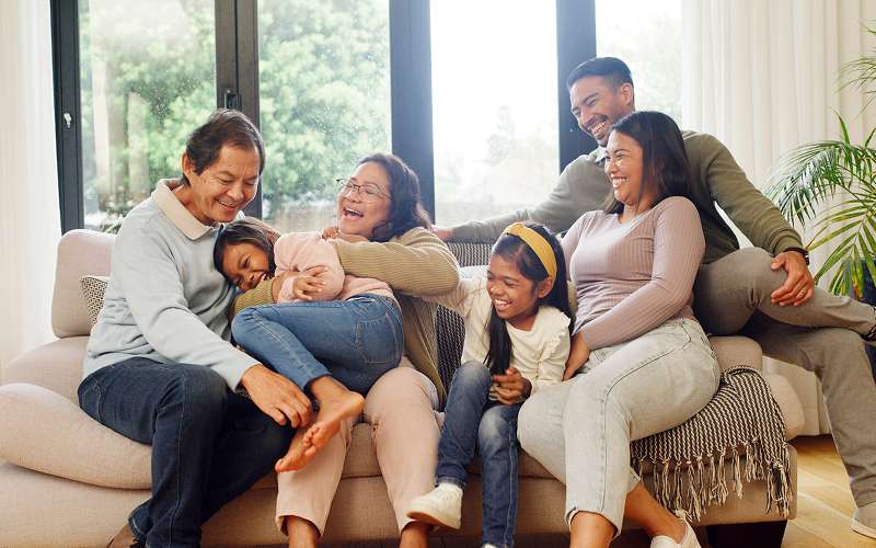 Multi-generational family enjoying group living in a serviced apartment.