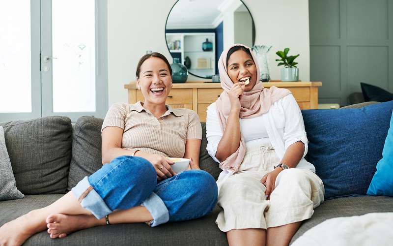 Friends sharing a three bedroom serviced apartment layout together.